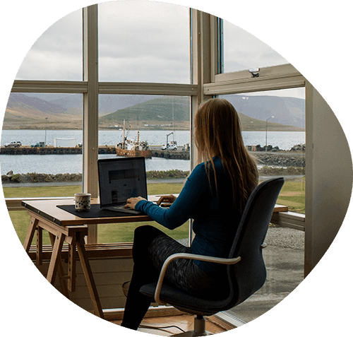 Woman on her laptop with a beautiful view